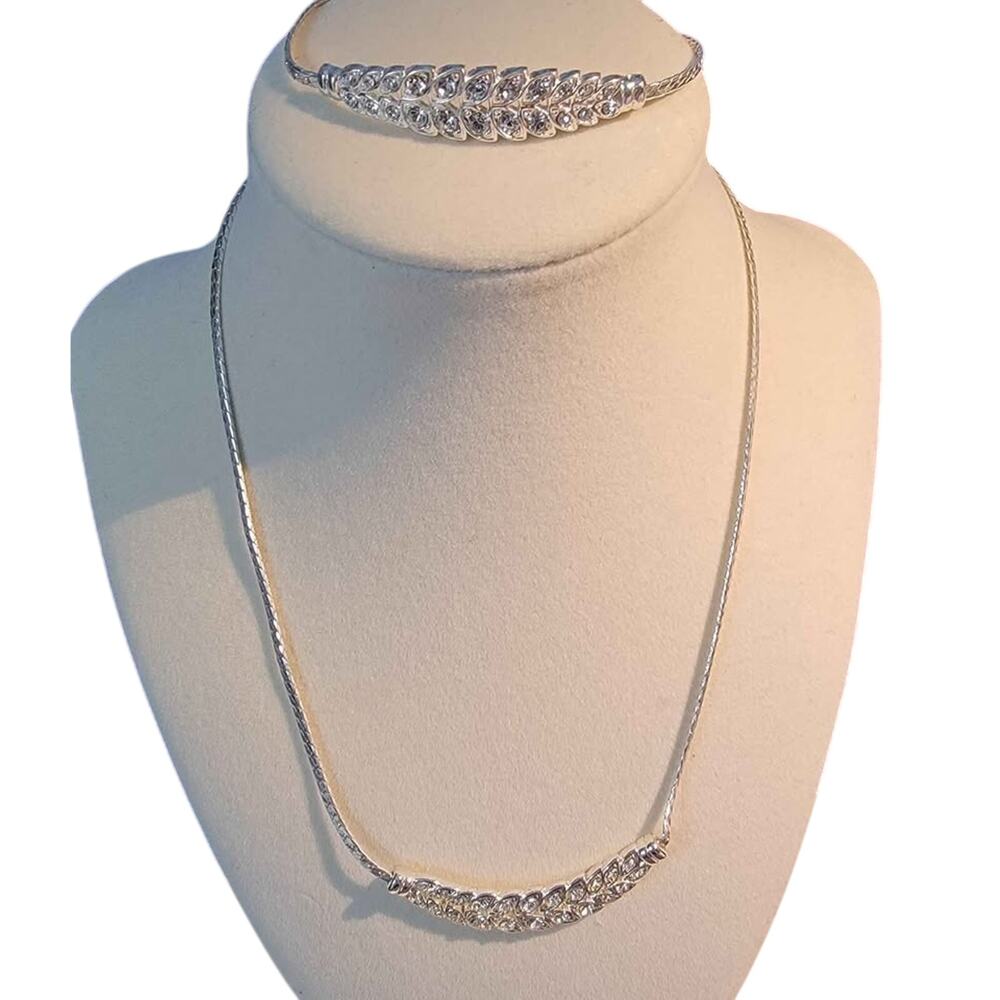 Beautiful silver-tone necklace and bracelet set. Both adjustable, and brand new.